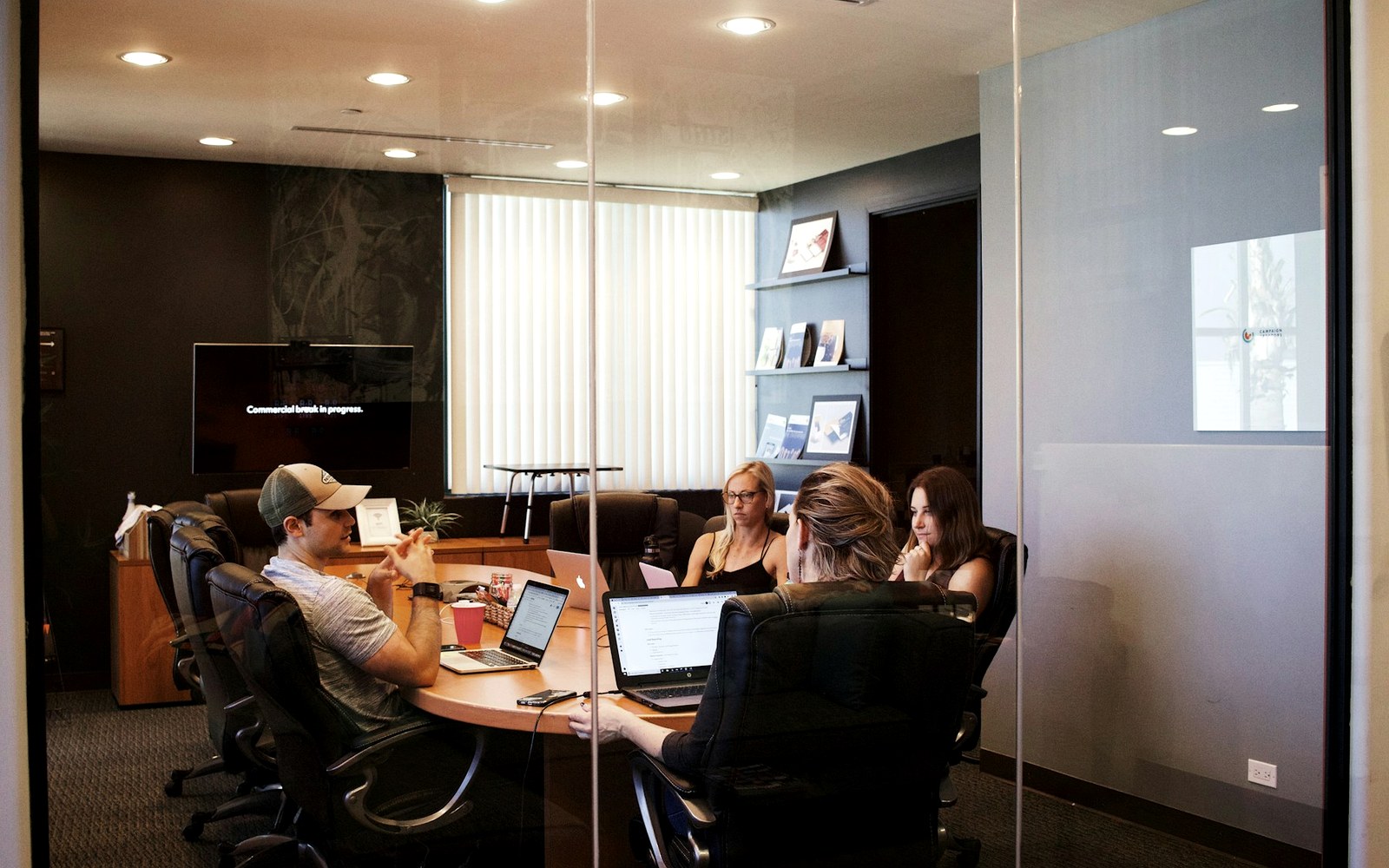 Office team planning campaign operations in a conference room